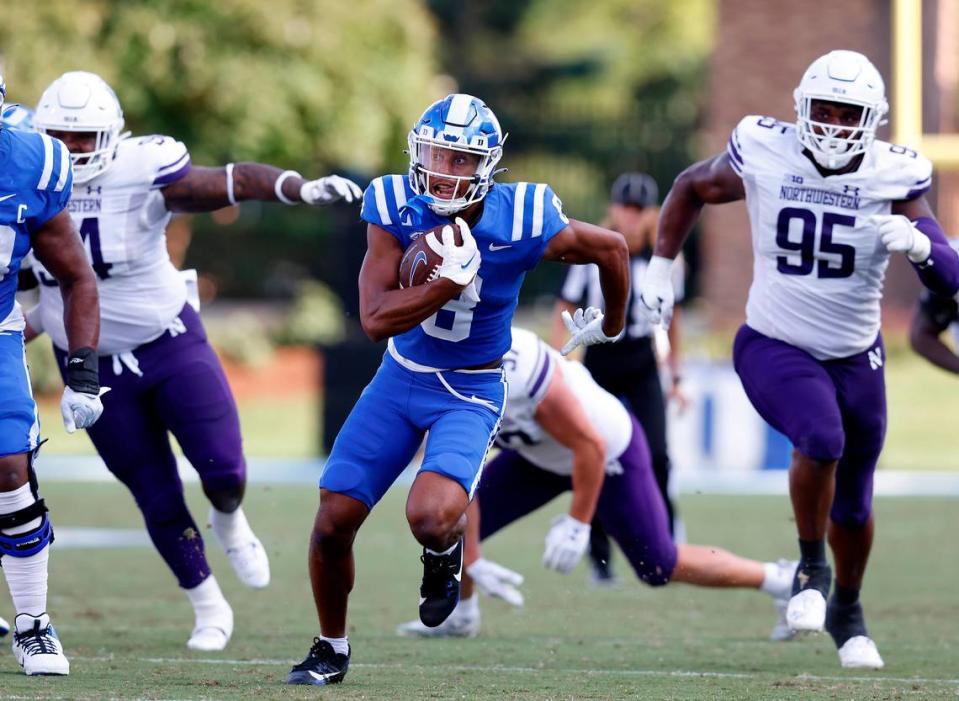 Duke’s Jordan Moore runs the ball during the second half of the Blue Devils’ 38-14 win over Northwestern on Saturday, Sept. 16, 2023, at Wallace Wade Stadium in Durham, N.C. Kaitlin McKeown/kmckeown@newsobserver.com
