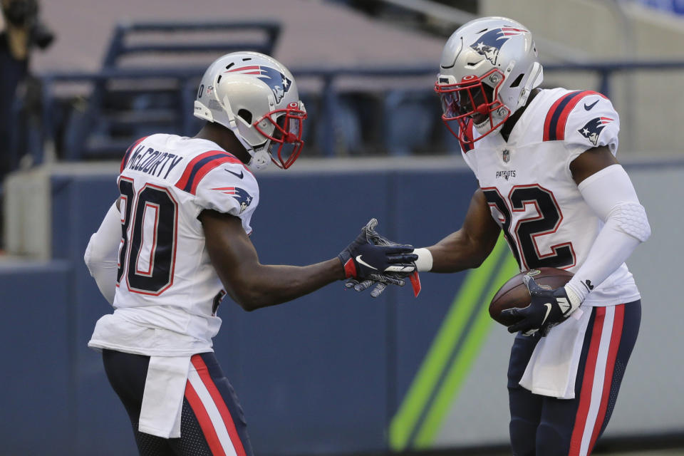 New England Patriots free safety Devin McCourty, right, and his twin brother Jason McCourty will try lead a big upset in Kansas City. (AP Photo/John Froschauer)