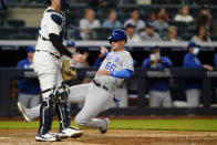 Kansas City Royals designated hitter Ryan O'Hearn (66) scores ahead of the throw to New York Yankees catcher Kyle Higashioka on Michael Taylor's RBI single during the eighth inning of a baseball game, Tuesday, June 22, 2021, at Yankee Stadium in New York. (AP Photo/Kathy Willens)