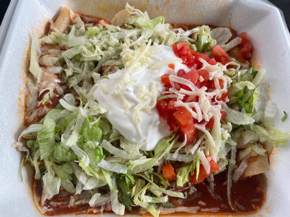 The enchiladas supremas at El Ranchero Express consist of one each of chicken, beef, cheese and bean. They’re served with salsa, lettuce and sour cream on top and rice and beans on the side.