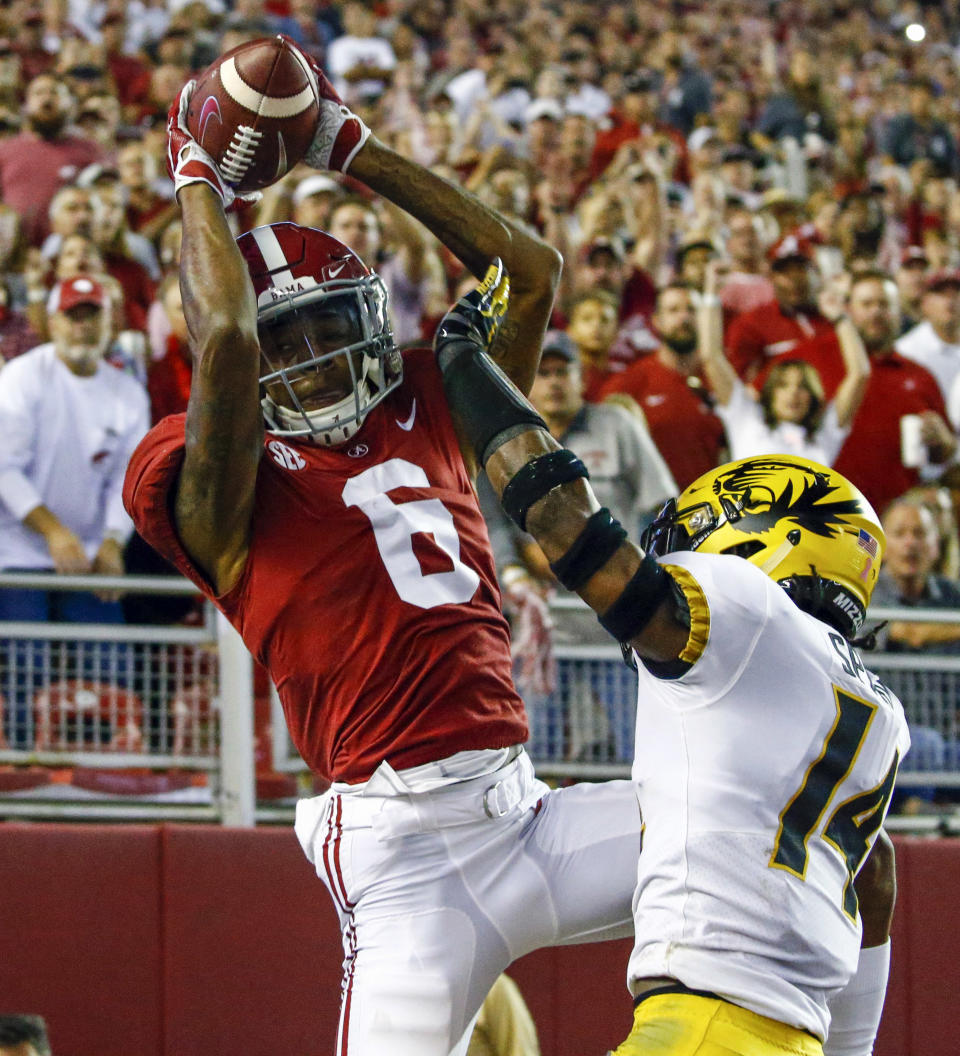 Alabama wide receiver DeVonta Smith (6) catches a pass over Missouri defensive back Adam Sparks (14) in the end zone, but is ruled out of bounds during the first half of an NCAA college football game, Saturday, Oct. 13, 2018, in Tuscaloosa, Ala. (AP Photo/Butch Dill)