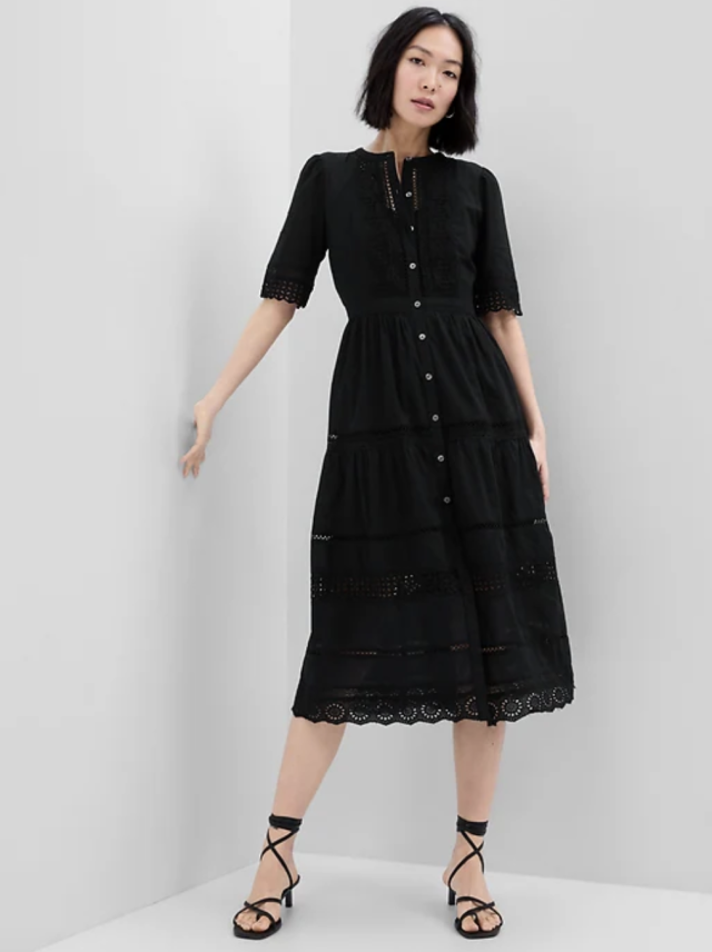 model wearing black sandals and Lace Button-Up Midi Dress in black (photo via Gap)