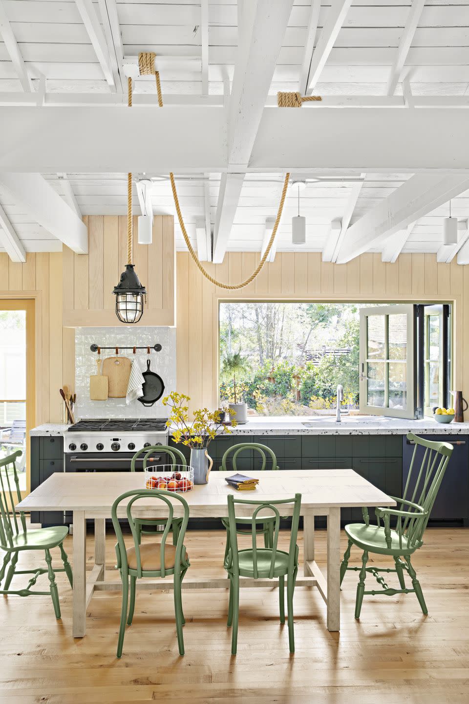 modern open kitchen with green cabinets