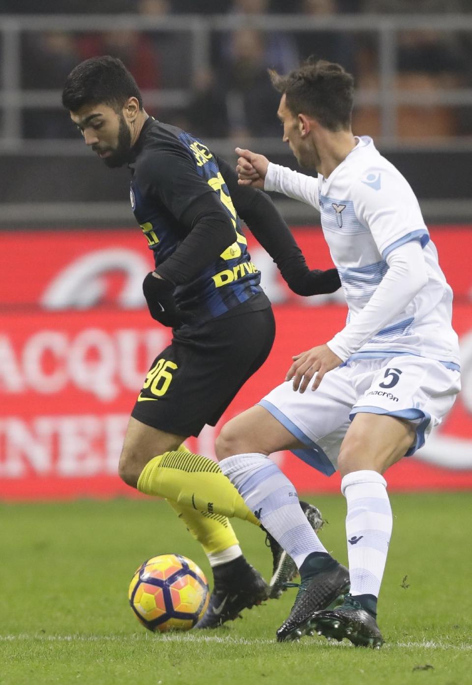 Inter Milan's Gabriel Barbosa, left, controls the ball past Lazio's Dino Cataldi during a Serie A soccer match between Inter Milan and Lazio, at the San Siro stadium in Milan, Italy, Wednesday, Dec. 21, 2016. (AP Photo/Luca Bruno)
