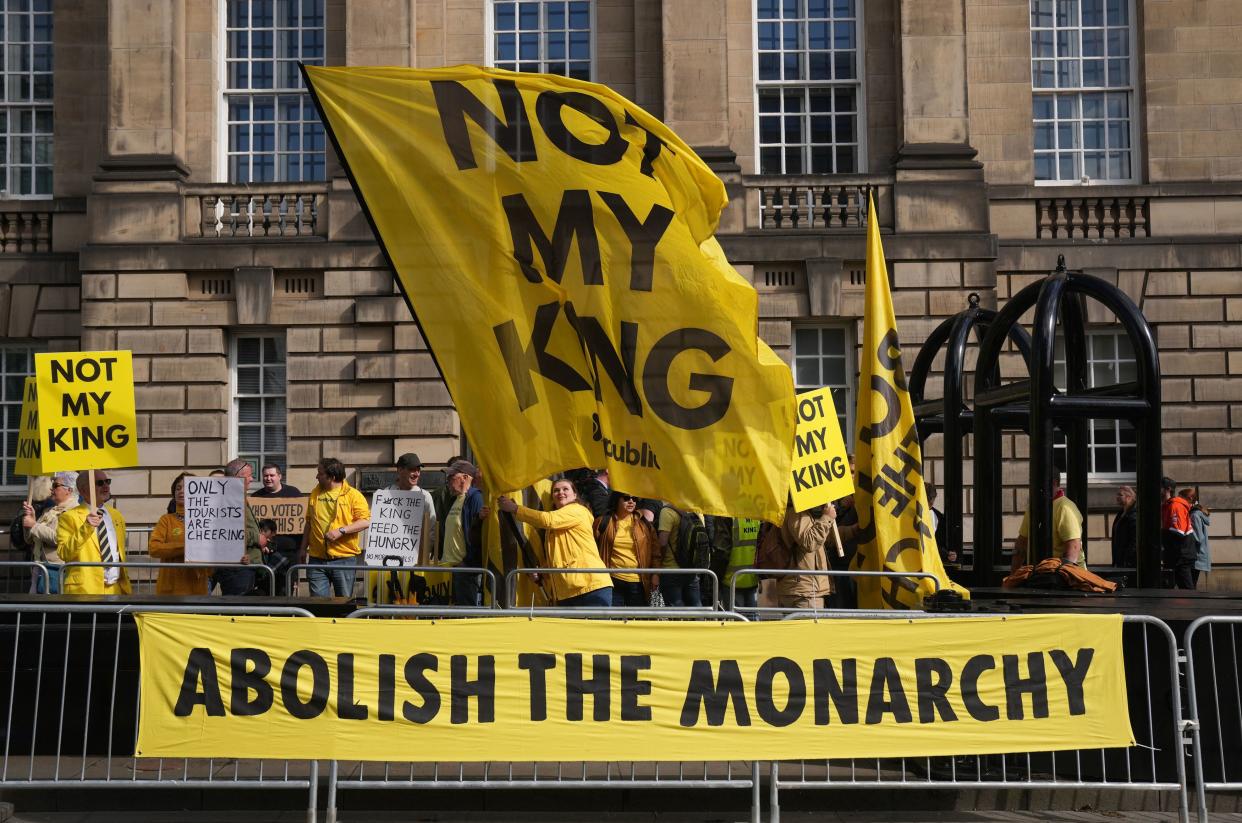 Anti-monarchy protesters gather near St Giles' Cathedral ahead of a National Service of Thanksgiving and Dedication, (AFP via Getty)