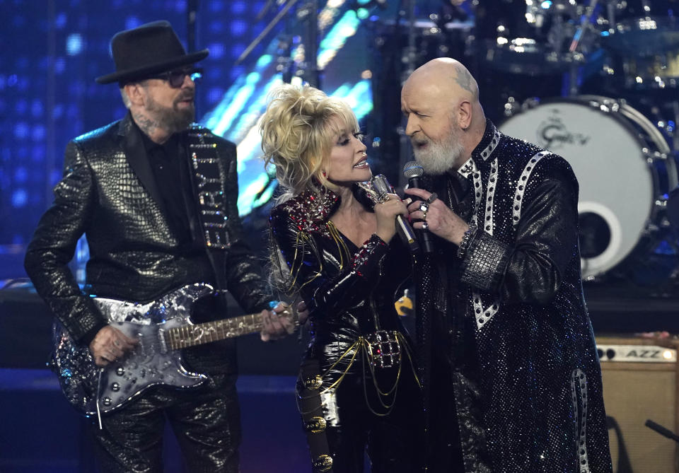 Inductees Dave Stewart of Eurythmics, from left, Dolly Parton and Rob Halford of Judas Priest perform during the Rock & Roll Hall of Fame Induction Ceremony on Saturday, Nov. 5, 2022, at the Microsoft Theater in Los Angeles. (AP Photo/Chris Pizzello)