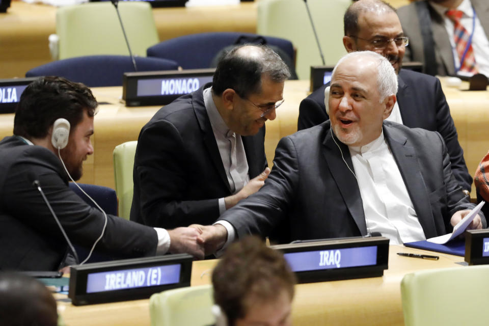 Iran's Foreign Minister Javad Zarif shakes hands with a delegate before his address to the High Level Political Forum on Sustainable Development, at United Nations headquarters, Wednesday, July 17, 2019. (AP Photo/Richard Drew)