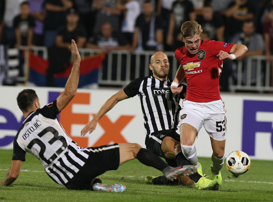 BELGRADE, SERBIA - OCTOBER 24: Brandon Williams of Manchester United in action with Nemanja Miletic and Bojan Ostojic of Partizan Belgrade during the UEFA Europa League group L match between Partizan and Manchester United at Partizan Stadium on October 24, 2019 in Belgrade, Serbia. (Photo by Matthew Peters/Manchester United via Getty Images)