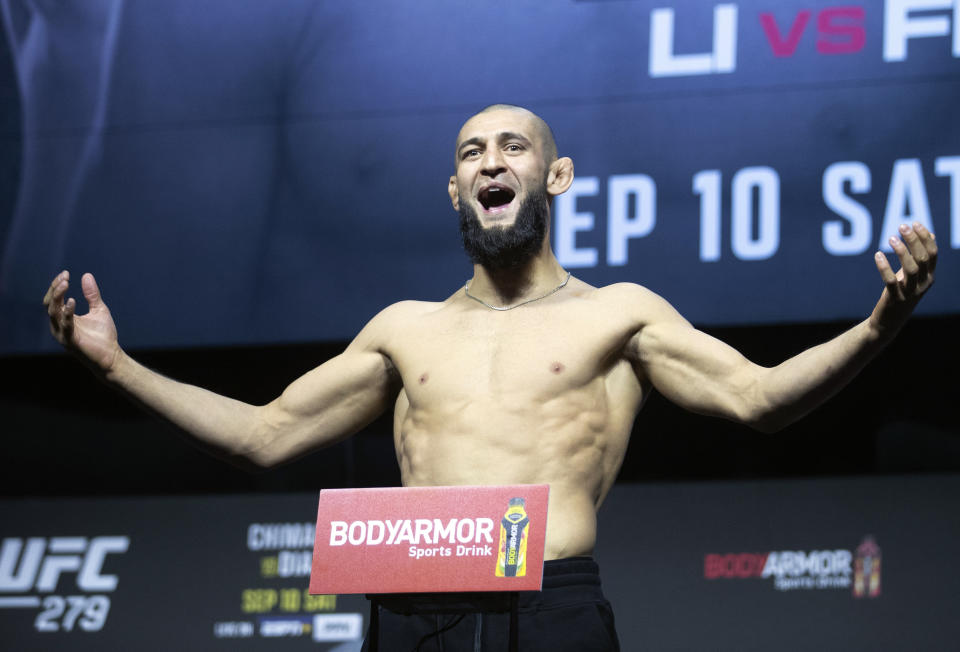 UFC fighter Khamzat Chimaev poses on the scale during a ceremonial weigh-in for the UFC 279 mixed martial arts event Friday, Sept. 9, 2022, in Las Vegas. Chimaev is scheduled to face Kevin Holland on Saturday. Chimaev was overweight for his scheduled bout against Nate Diaz. (Steve Marcus/Las Vegas <a class="link " href="https://sports.yahoo.com/wnba/teams/connecticut/" data-i13n="sec:content-canvas;subsec:anchor_text;elm:context_link" data-ylk="slk:Sun;sec:content-canvas;subsec:anchor_text;elm:context_link;itc:0">Sun</a> via AP)/Las Vegas Sun via AP)