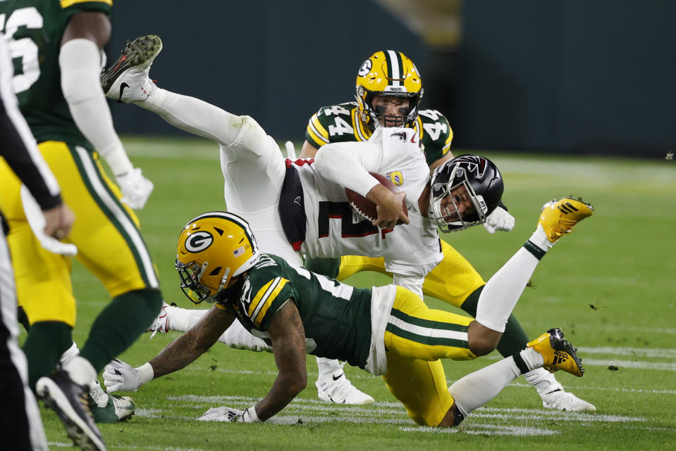 Atlanta Falcons quarterback Matt Ryan (2) is tackled by Green Bay Packers' Jaire Alexander (23) during the second half of an NFL football game, Monday, Oct. 5, 2020, in Green Bay, Wis. (AP Photo/Tom Lynn)