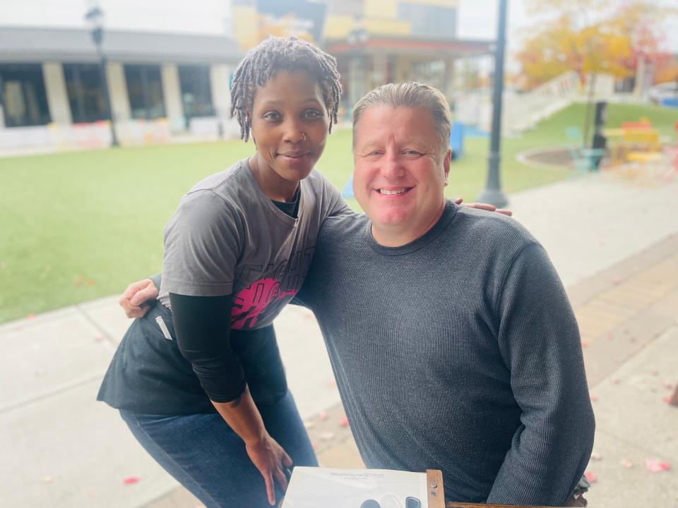 T'Shayla Jones, server at Ford's Garage in Noblesville, said people love the Jiffy Burger named after local sports radio host John Michael Vincent (JMV).