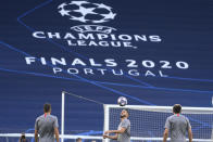 Atletico Madrid's Koke, centre, heads for the ball during a training session at the Jose Alvalade stadium in Lisbon, Wednesday Aug. 12, 2020. Atletico Madrid will play Leipzig in a Champions League quarterfinals soccer match on Thursday. (Lluis Gene/Pool via AP)