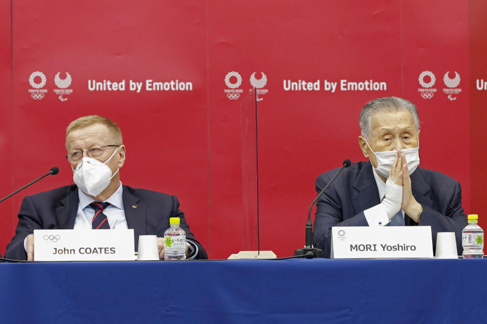 Yoshiro Mori, president of the Tokyo 2020 organizing committee, right, sits with John Coates, chairman of the Coordination Commission for the Tokyo 2020 Olympics, during a press conference in Tokyo, Wednesday, Nov. 18, 2020. (Rodrigo Reyes Marin/Pool Photo via AP)