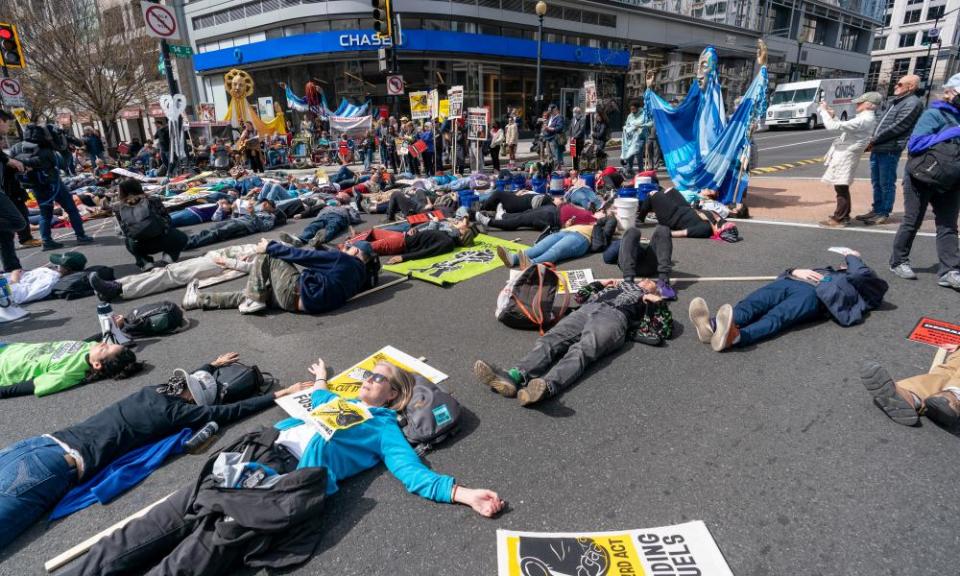 Activists stage a ‘die-in’ in front of a Chase branch.