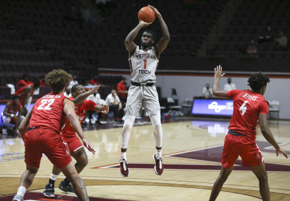 Virginia Tech's Joseph "Joe" Bamisile (1) shoots over the Radford defense during the second half of an NCAA college basketball game, Wednesday Nov. 25, 2020, in Blacksburg Va. (Matt Gentry/The Roanoke Times via AP)