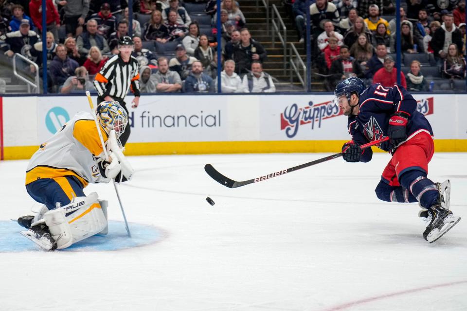 Oct 20, 2022; Columbus, Ohio, USA;  Columbus Blue Jackets forward Justin Danforth (17) scores a goal against Nashville Predators goaltender Kevin Lankinen (32) during the third period of the hockey game between the Columbus Blue Jackets and the Nashville Predators at Nationwide Arena. Mandatory Credit: Joseph Scheller-The Columbus Dispatch