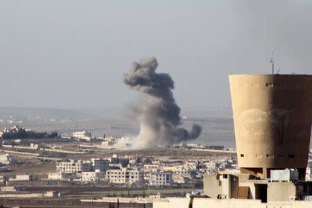 Smoke rises after airstrikes by pro-Syrian government forces in Anadan city, about 10 kilometers away from the towns of Nubul and Zahraa, Northern Aleppo countryside, Syria February 3, 2016. REUTERS/Abdalrhman Ismail