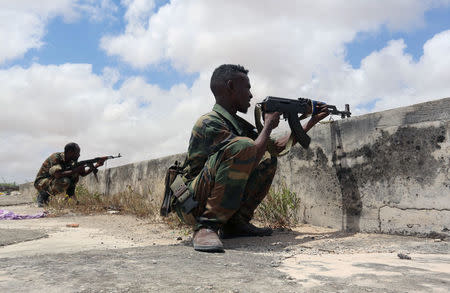 FILE PHOTO: Members of Somali Armed Forces take their position during fighting between the military and police backed by intelligence forces in the Dayniile district of Mogadishu, Somalia, September 16, 2017. REUTERS/Feisal Omar/File Photo