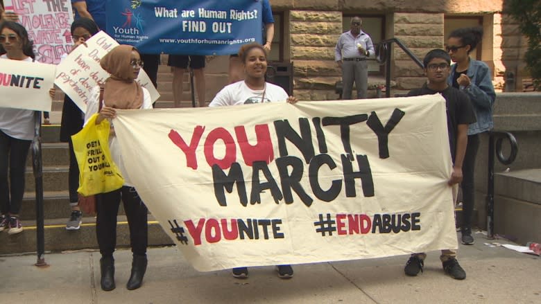 Youth march from Old City Hall to Regent Park to raise awareness about domestic abuse