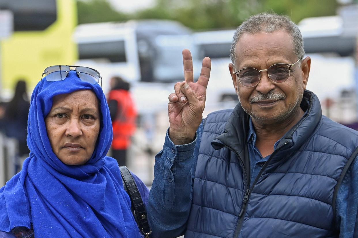 Wahied and Fatima Hassan, evacuees from Halfaya near Khartoum, Sudan, pose for a picture (REUTERS)