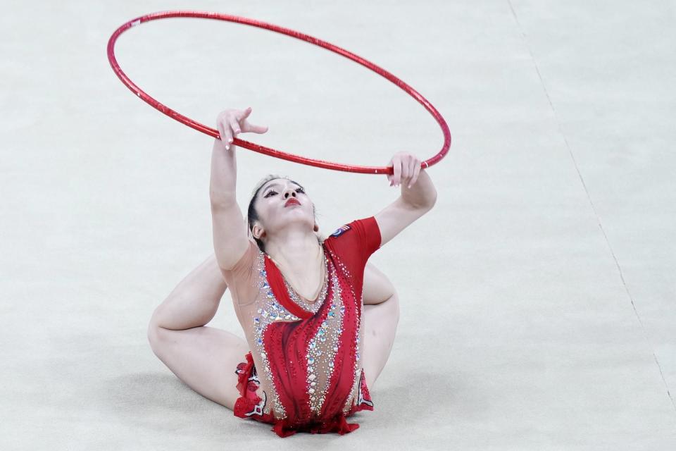 Ng Joe Ee of Malaysia performs during Individual qualification and Individual team final subdivision 2 of Rhythmic Gymnastics final at the 19th Asian Games in Hangzhou, China, Friday, Oct. 6, 2023. (AP Photo/Eugene Hoshiko)