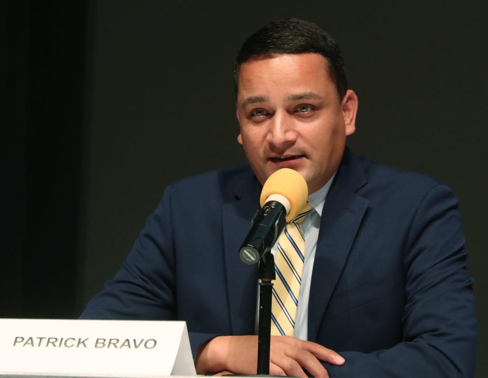School Board candidate Patrick Bravo answers a question during the Akron City School Board Candidate Forum at the Akron-Summit County Library in Akron.