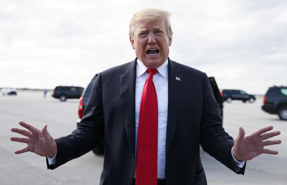 President Donald Trump speaks to media before boarding Air Force One on March 24, 2019, at Palm Beach International Airport, in West Palm Beach, Fla., en route to Washington. (Photo: Carolyn Kaster/AP)