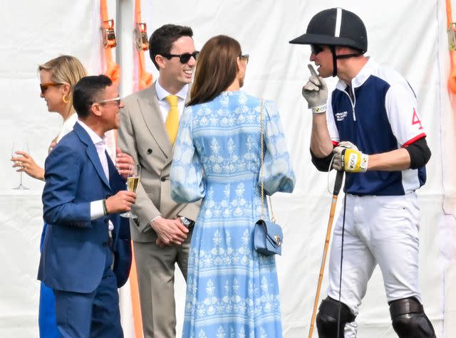 <p>Samir Hussein/WireImage</p> Kate Middleton and Prince William at the charity polo match on July 6