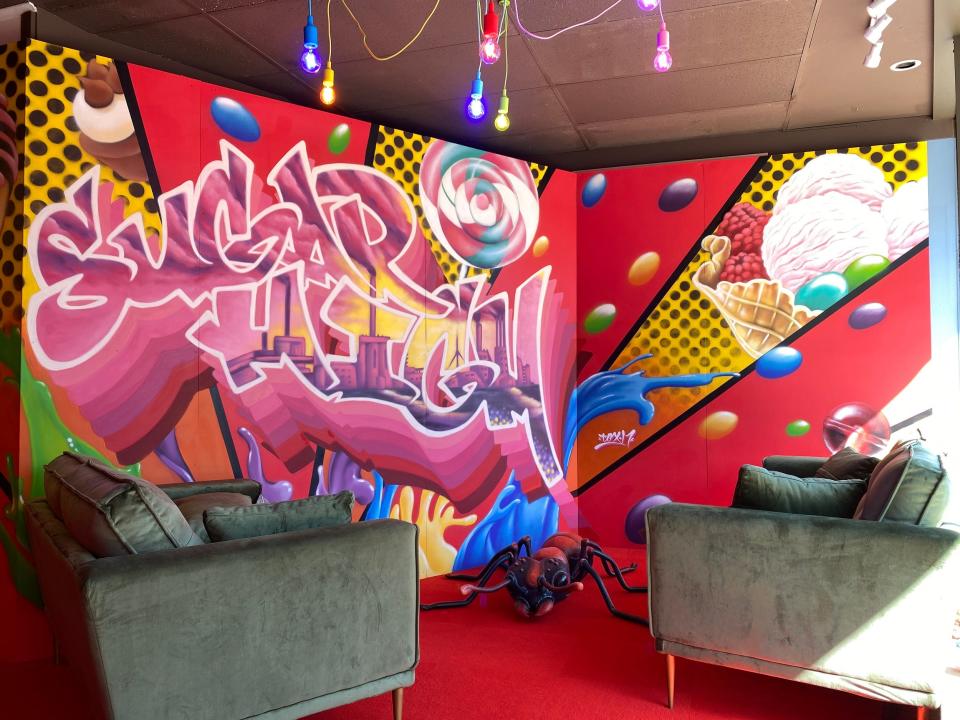 Enid artist Tox Murillo painted the "Sugar High Mural" on view in the Lounge of the immersive art experience "Sugar High," open through May 8 in Enid.