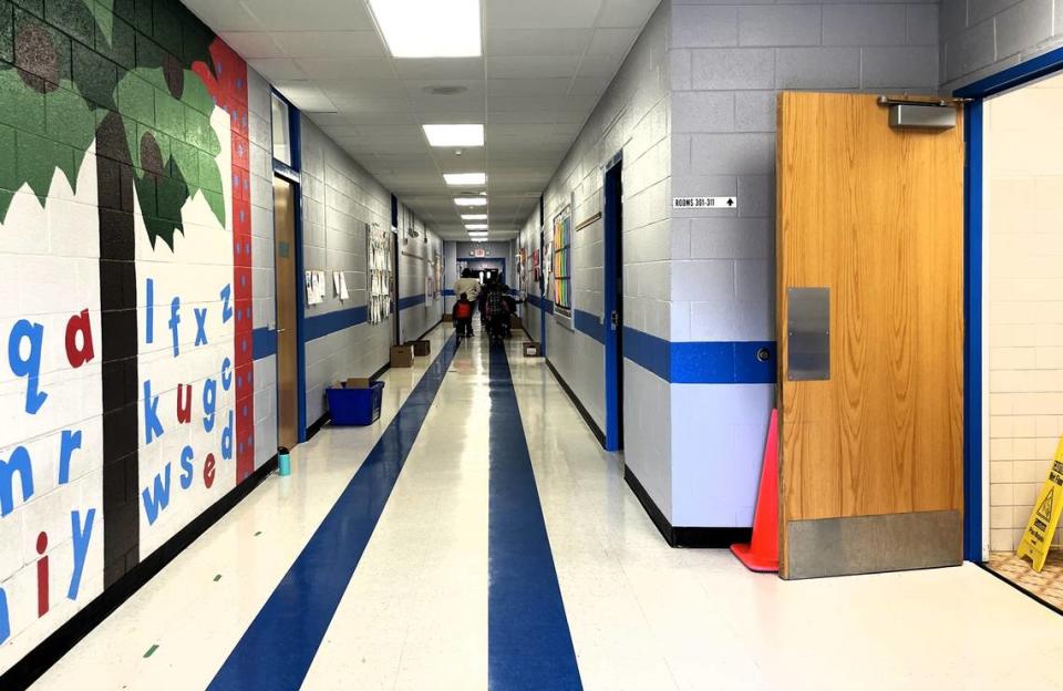 Orange County Schools Maintenance Director Hank McKee said the stripes on Hillsborough Elementary School floors help kids line up correctly. The blue lines on the walls are located where they leave fingerprints, he said, so his team doesn’t have to repaint everything.