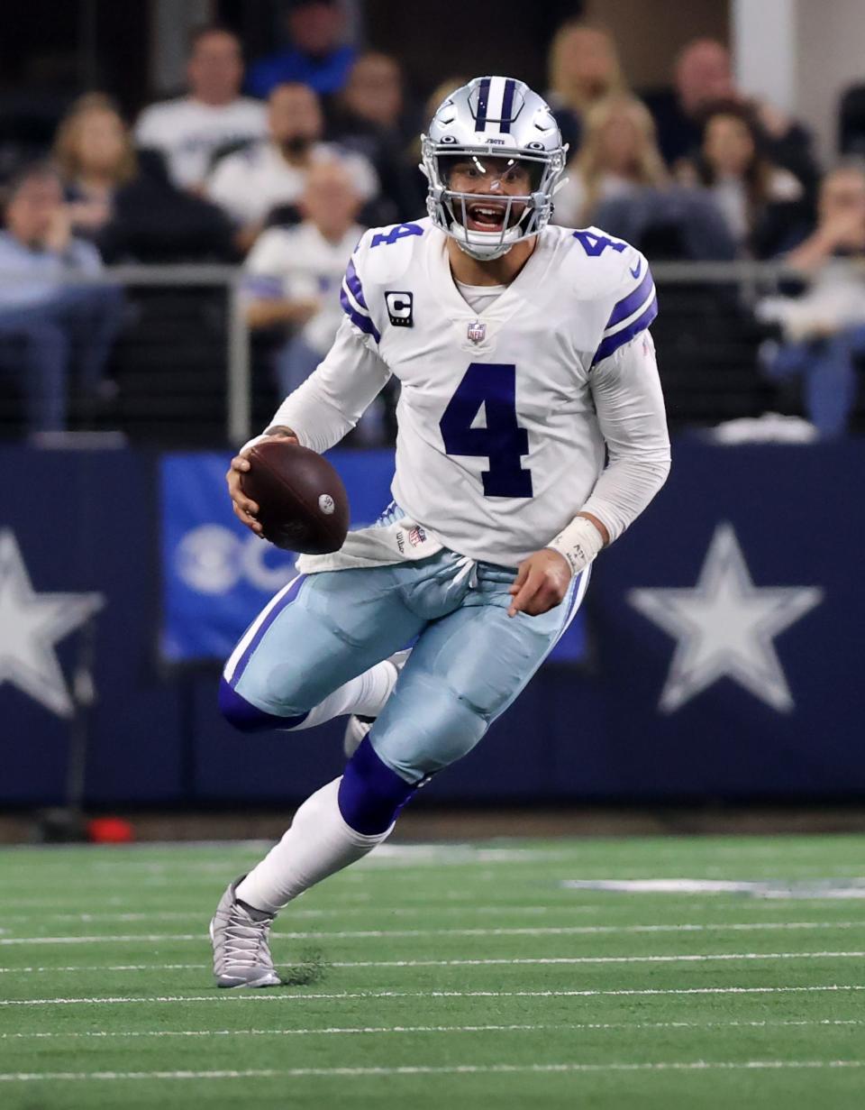 Cowboys quarterback Dak Prescott scrambles in the second half against the 49ers.