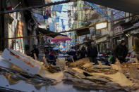 Banners and writings in support of Napoli soccer team are displayed in downtown Naples, Italy, Wednesday, April 19, 2023. It's a celebration more than 30 years in the making, and historically superstitious Napoli fans are already painting the city blue in anticipation of the team's first Italian league title since the days when Diego Maradona played for the club. (AP Photo/Andrew Medichini)