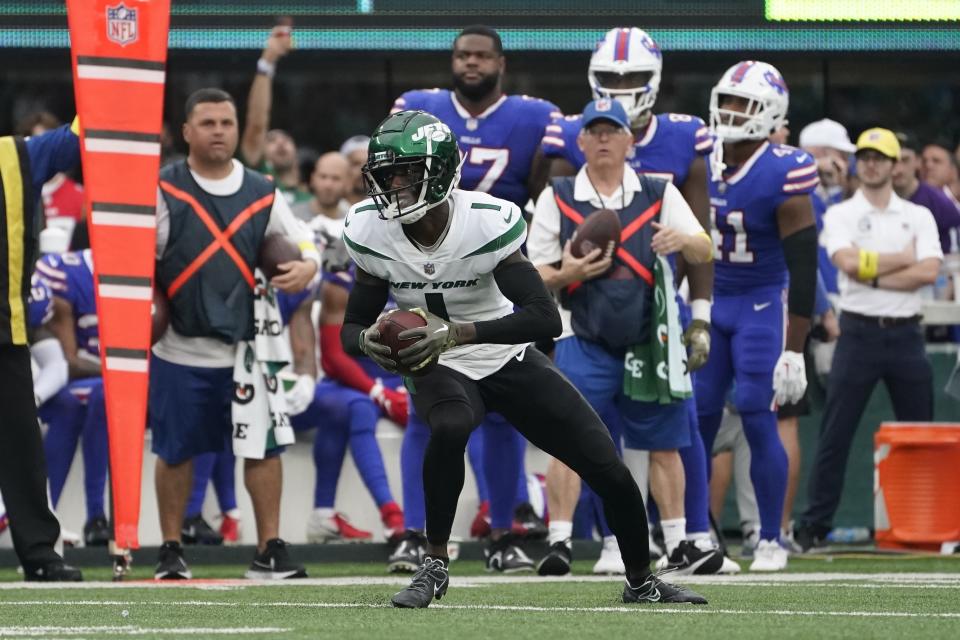 New York Jets cornerback Sauce Gardner (1) runs back an interception during the second half of an NFL football game against the Buffalo Bills, Sunday, Nov. 6, 2022, in East Rutherford, N.J. (AP Photo/John Minchillo)