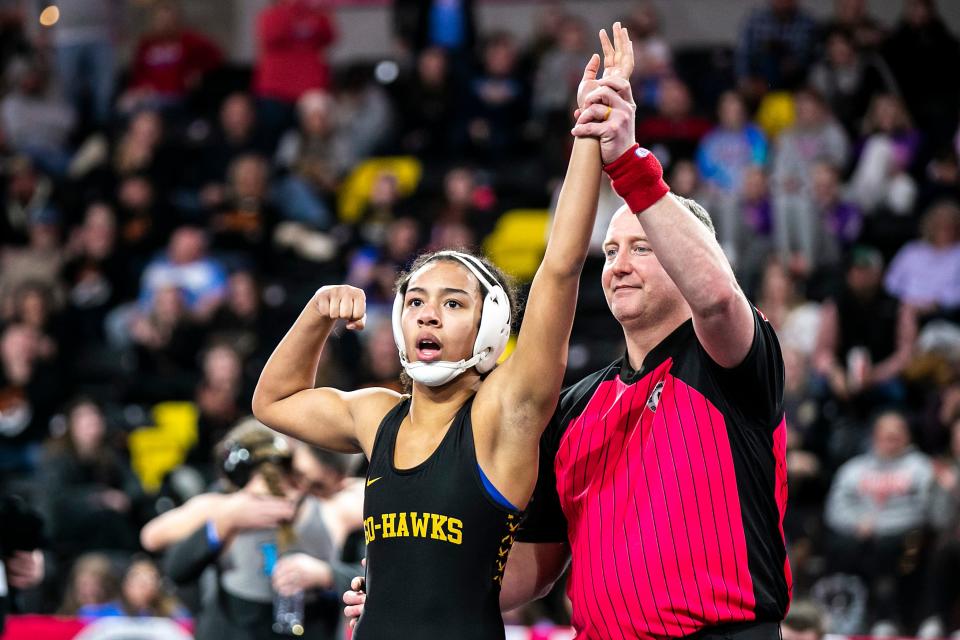 Waverly-Shell Rock's Kiara Djoumessi celebrates after scoring a fall at 140 pounds in the finals during the IGHSAU state girls wrestling tournament.