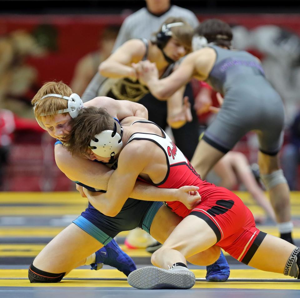 Kolten Barker of Louisville, left, grapples with Collin Twigg of Wauseon during their 126-pound Division II quarterfinal match in the OHSAA State Wrestling Tournament at the Jerome Schottenstein Center, Saturday, March 11, 2023, in Columbus, Ohio.