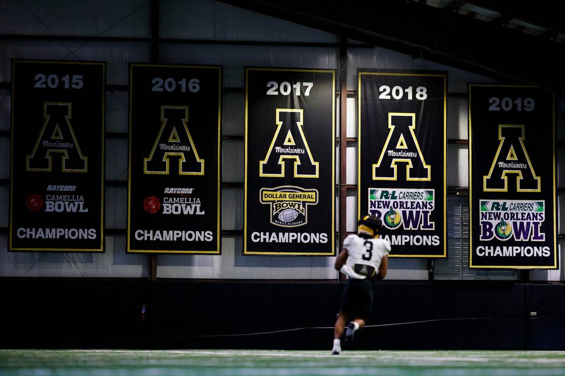 Banners celebrating Appalachian States past bowl game wins hang in the teams indoor practice facility in Boone, N.C., Tuesday, Aug. 30, 2022.