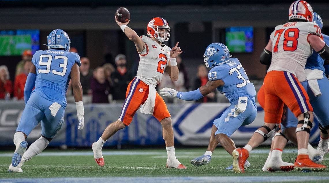 Clemson quarterback Cade Klubnik (2) looks for a receiver in the the quarter as he is pressured by North Carolina’s Cedric Gray (33) during the ACC Championship game on Saturday, December 3, 2022 at Bank of American Stadium in Charlotte, N.C. Klubnik passed for 279 yards and one touchdown.