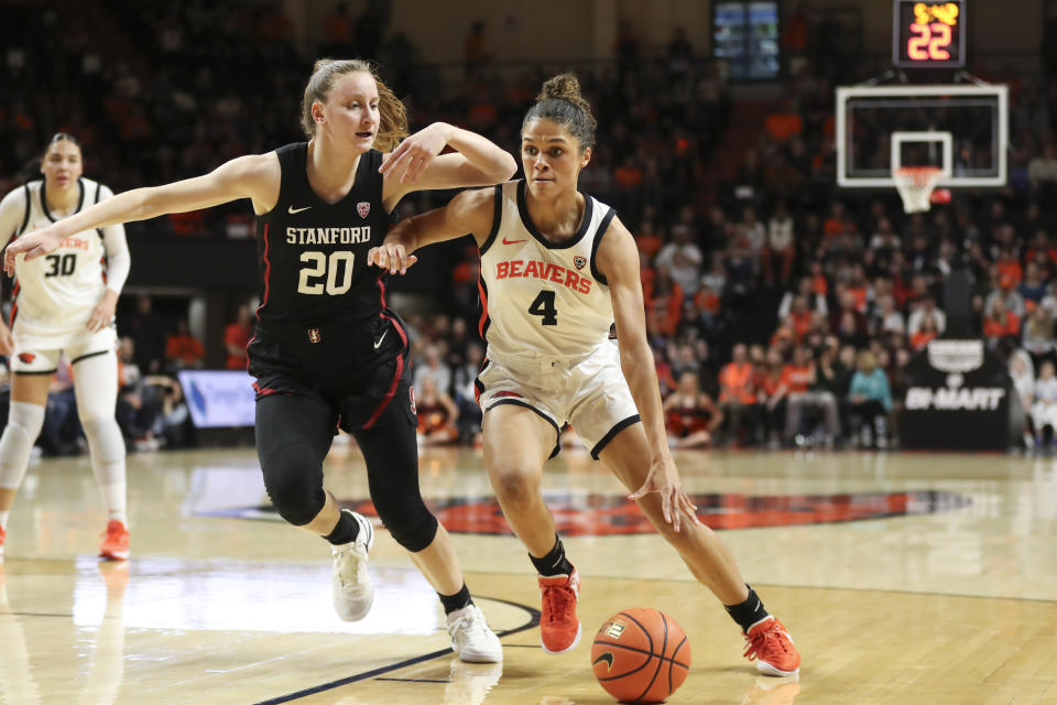 Oregon State guard Donovyn Hunter (4) drives to the basket as Stanford guard Elena Bosgana (20) defends during the first half of an NCAA college basketball game Thursday, Feb. 29, 2024, in Corvallis, Ore. (AP Photo/Amanda Loman)