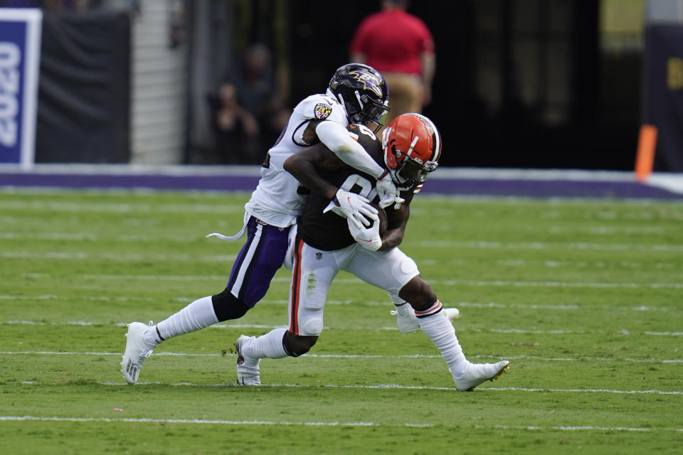 Baltimore Ravens safety DeShon Elliott (32) tackles Cleveland Browns wide receiver Jarvis Landry (80), during the first half of an NFL football game, Sunday, Sept. 13, 2020, in Baltimore, MD. (AP Photo/Julio Cortez)