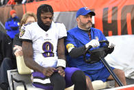 Baltimore Ravens quarterback Lamar Jackson (8) is carted off the field after an injury during the first half of an NFL football game against the Cleveland Browns, Sunday, Dec. 12, 2021, in Cleveland. (AP Photo/David Richard)