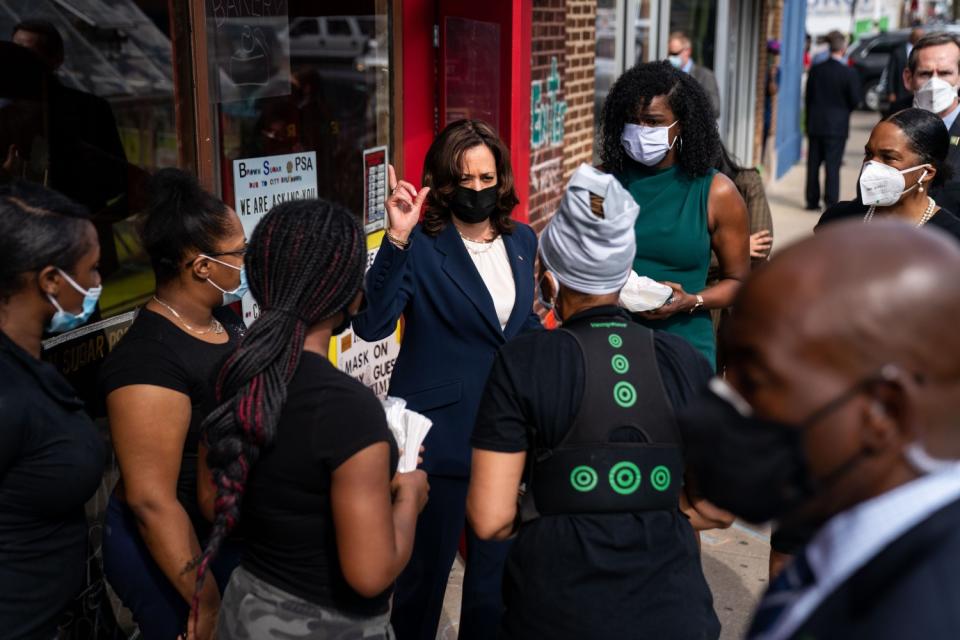 Vice President Kamala Harris speaks to a small group of people