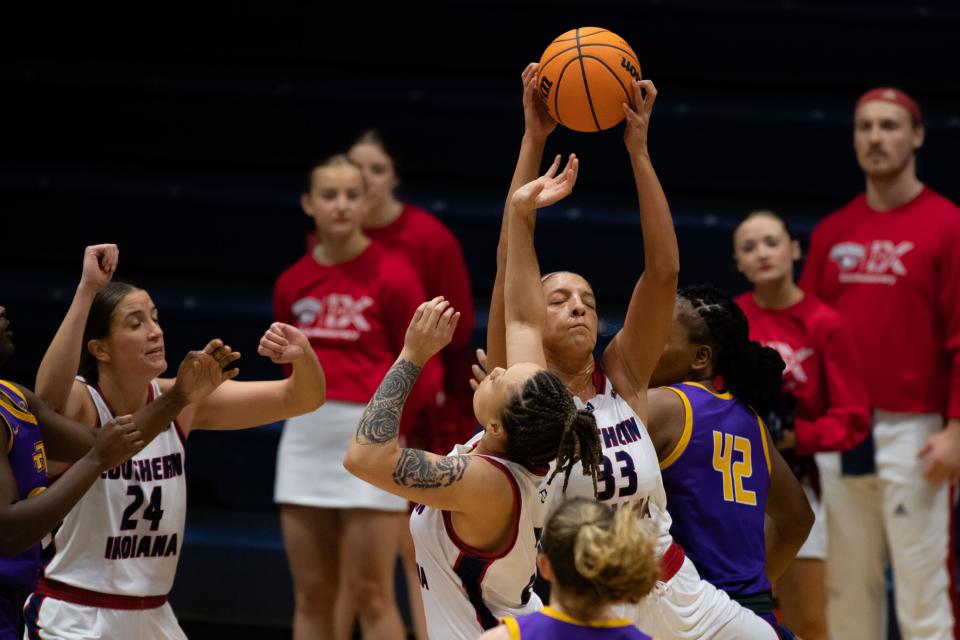 Southern Indiana’s Hannah Haithcock (33) reaches for the rebound against the Tennessee Tech Golden Eagles during a match at the University of Southern Indiana on Thursday, Feb. 23, 2023.