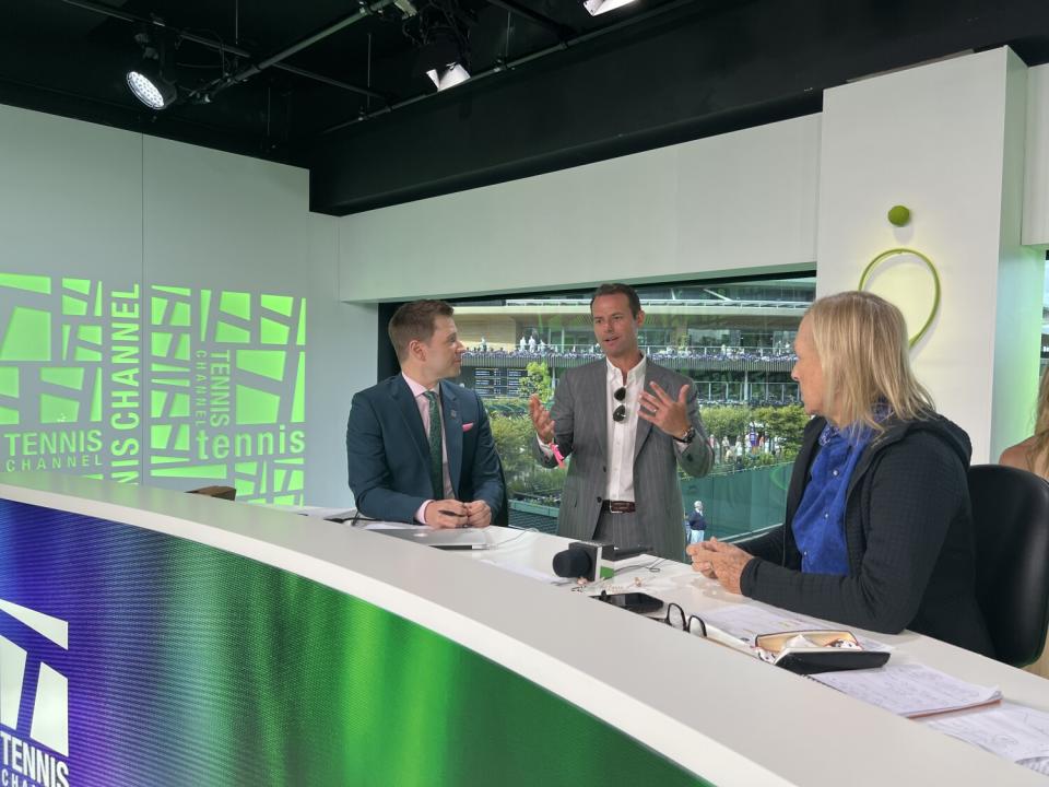 Brandon Staley talks to Steve Weissman and Martina Navratilova on a TV set.