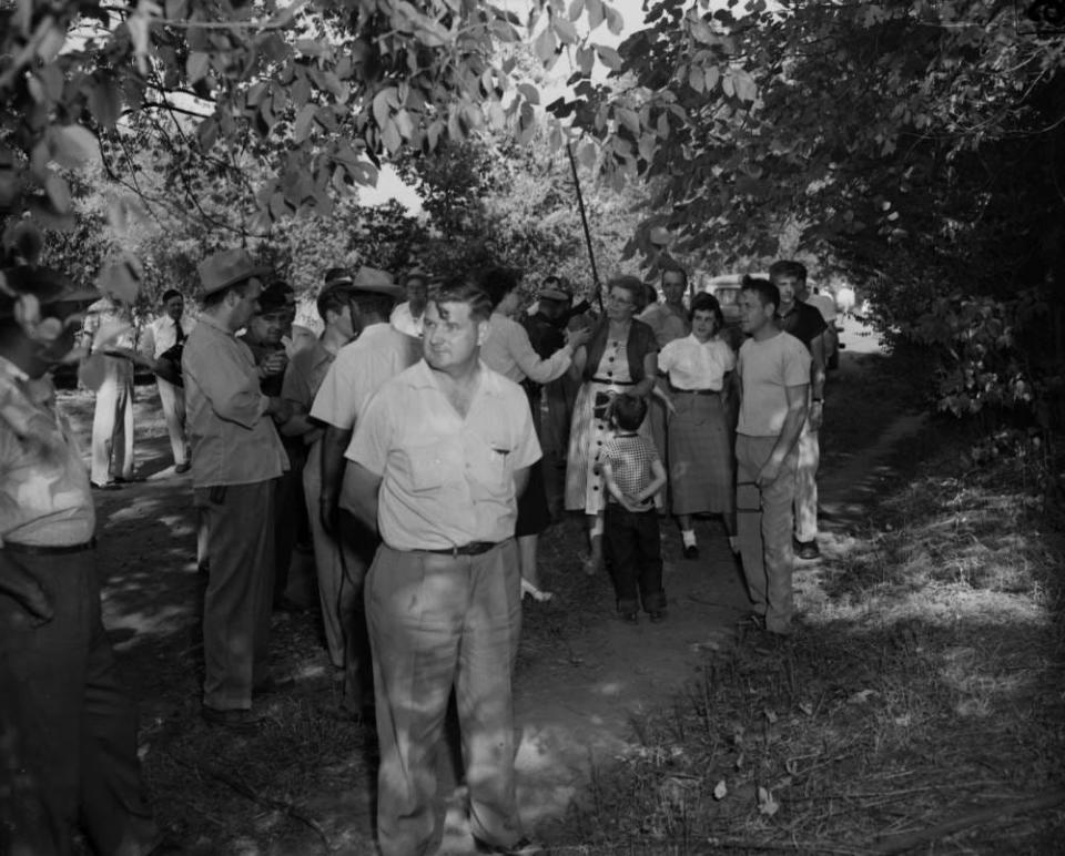 Springfield residents stand around during a cobra hunt in September 1953. Between August and October 1953, 11 monocled cobras were spotted in Springfield.