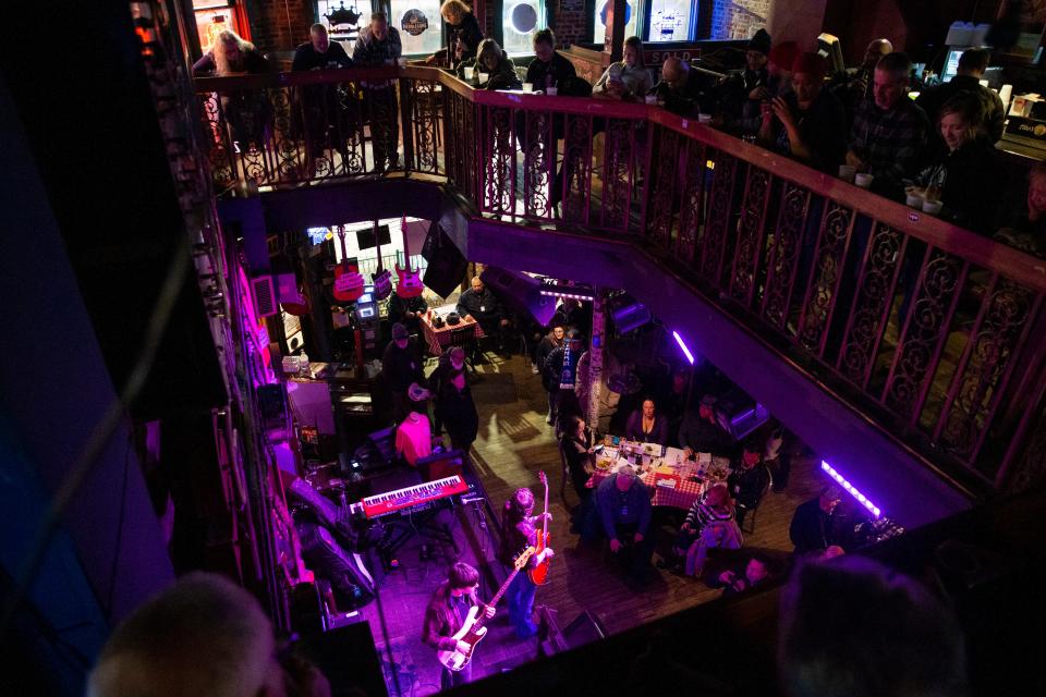 Audience members watch from the second floor as The Sean McKee Band performs at Rum Boogie Cafe in the first round of the quarterfinals during the International Blues Challenge on Beale Street in Memphis on Jan. 17.