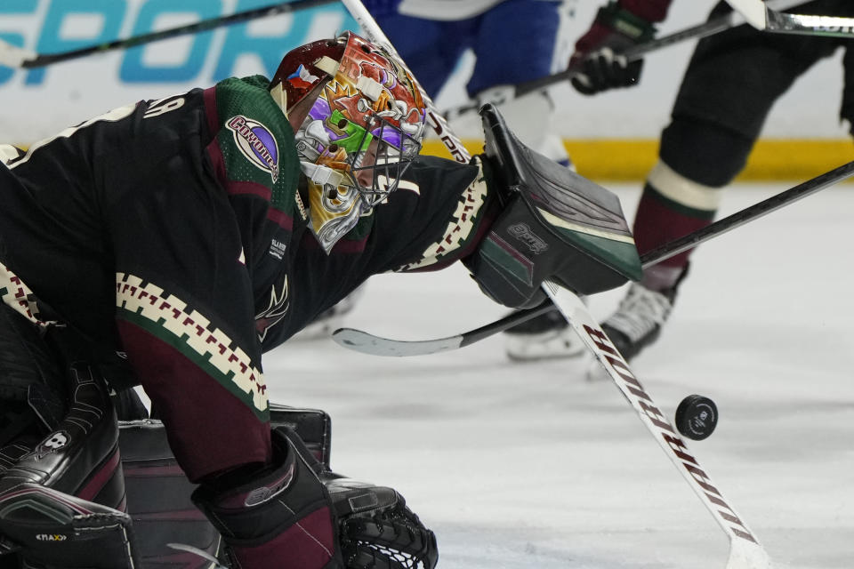 Arizona Coyotes goaltender Karel Vejmelka makes a save on Toronto Maple Leafs center Auston Matthews during the second period of an NHL hockey game Wednesday, Feb. 21, 2024, in Tempe, Ariz. (AP Photo/Rick Scuteri)