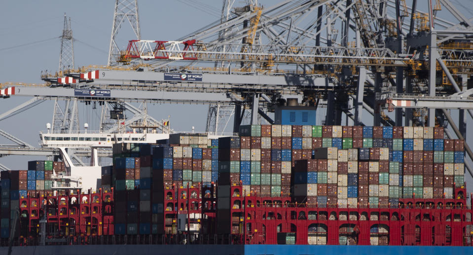 In this Monday, March 23, 2020 file photo, shipping containers are offloaded from a vessel in the Port of Antwerp, Belgium. They can’t expect much sympathy, but lockdowns and travel restrictions mean small-time drug dealers can’t do business as usual during the coronavirus pandemic. Street sellers in Brussels and Paris have changed their work hours and delivery methods due to the end of public nightlife and a drop in demand. (AP Photo/Virginia Mayo, File)