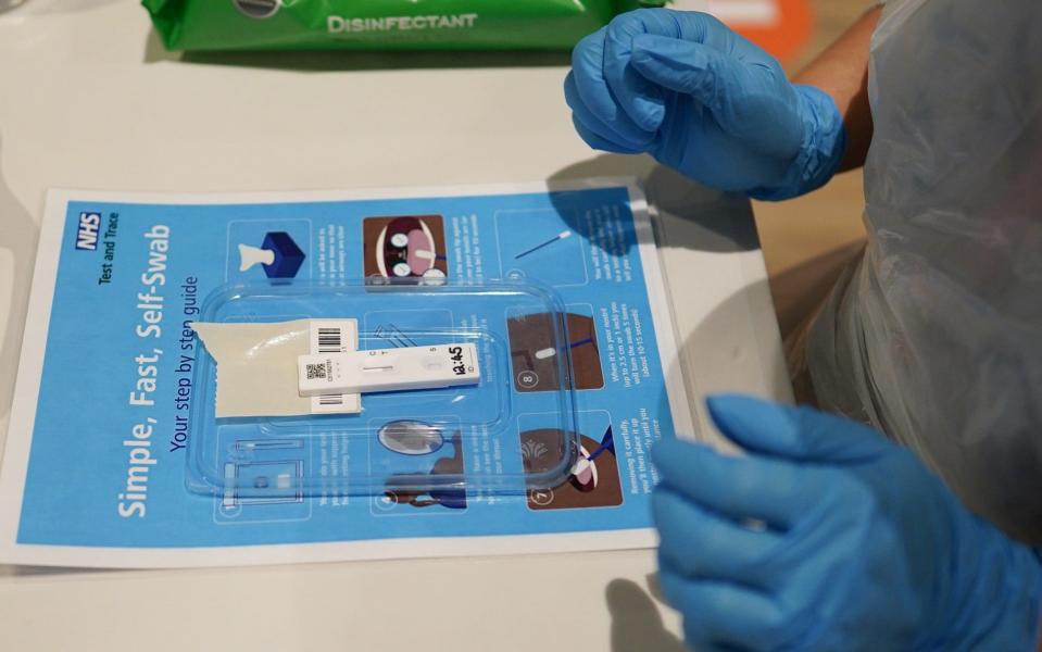 A lateral flow test is processed during a community testing pilot scheme in Redcar. The tests could now be ordered by the employees of small companies - Ian Forsyth/Getty Images