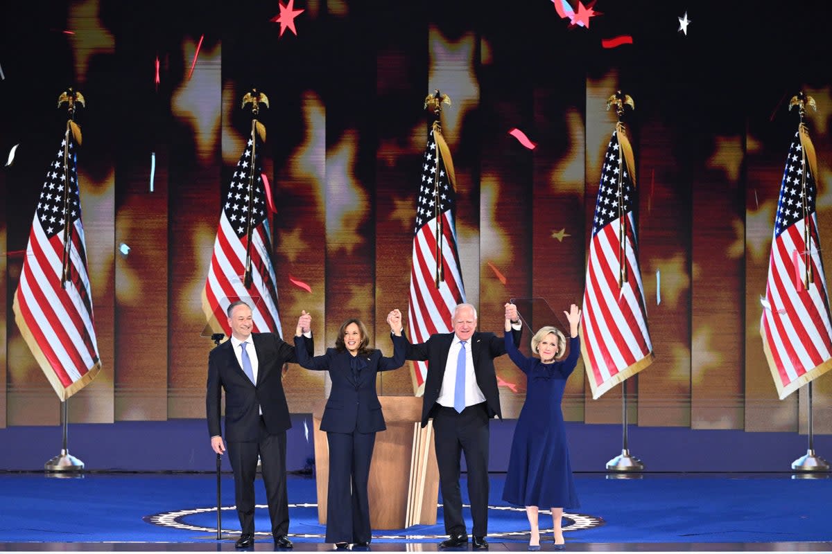 Democratic presidential candidate Kamala Harris onstage with Second Gentleman Douglas Emhoff, Minnesota Governor and Democratic vice presidential candidate Tim Walz and his wife Gwen Walz (AFP via Getty Images)