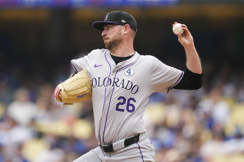 Colorado Rockies starting pitcher Austin Gomber (26) throws to second during the third inning of a baseball game against the Los Angeles Dodgers in Los Angeles, Sunday, June 2, 2024. (AP Photo/Ashley Landis)